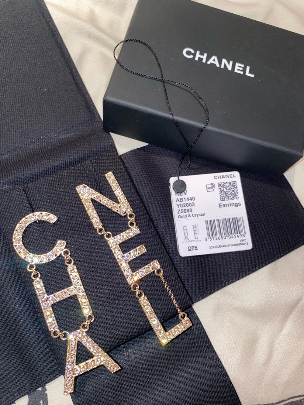 CHANEL Gold Crystal Logo Dangle Earrings